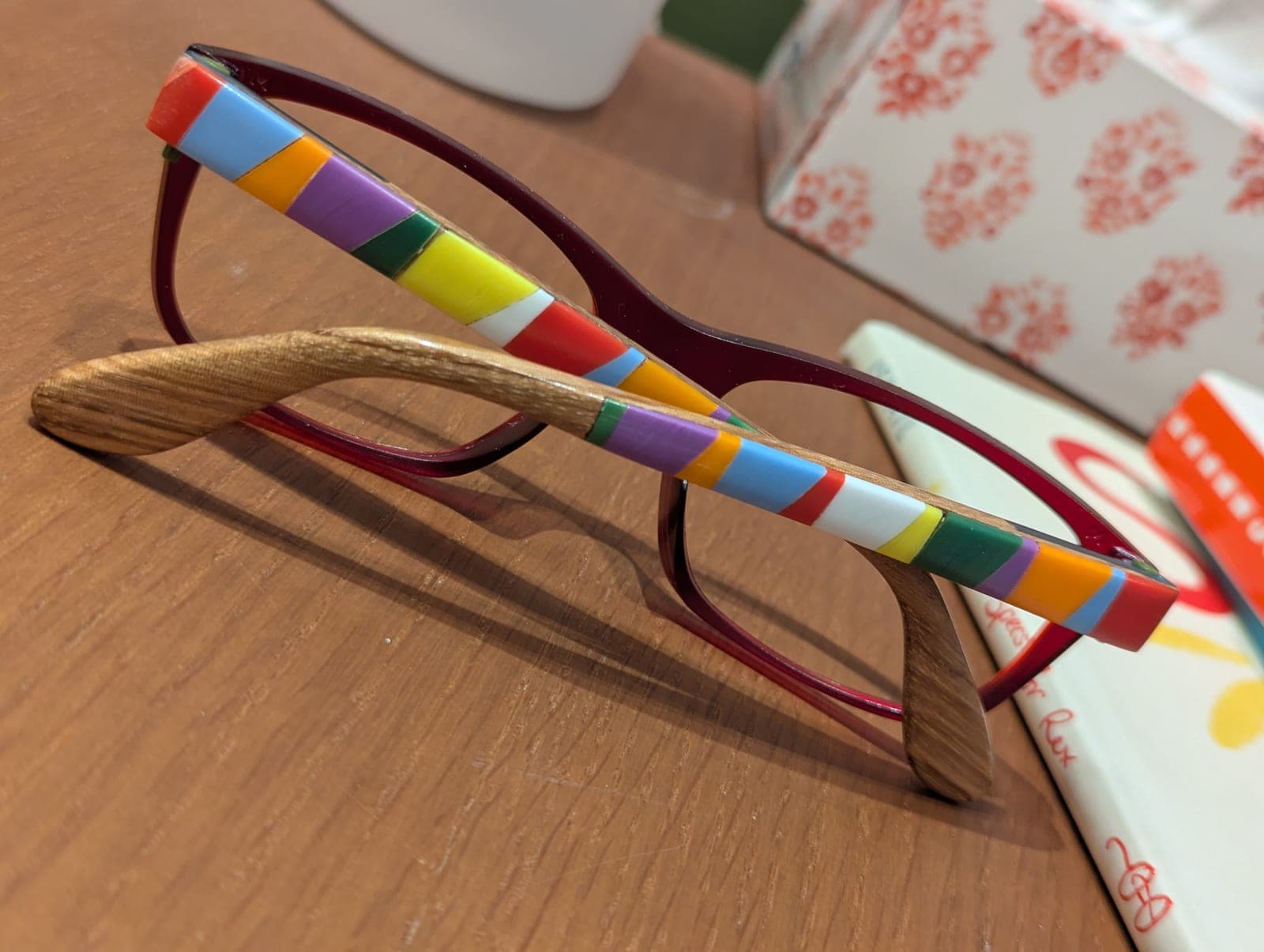 Clear upcycled material eyeglass frames with light oak wood temples featuring a dark striped inlay