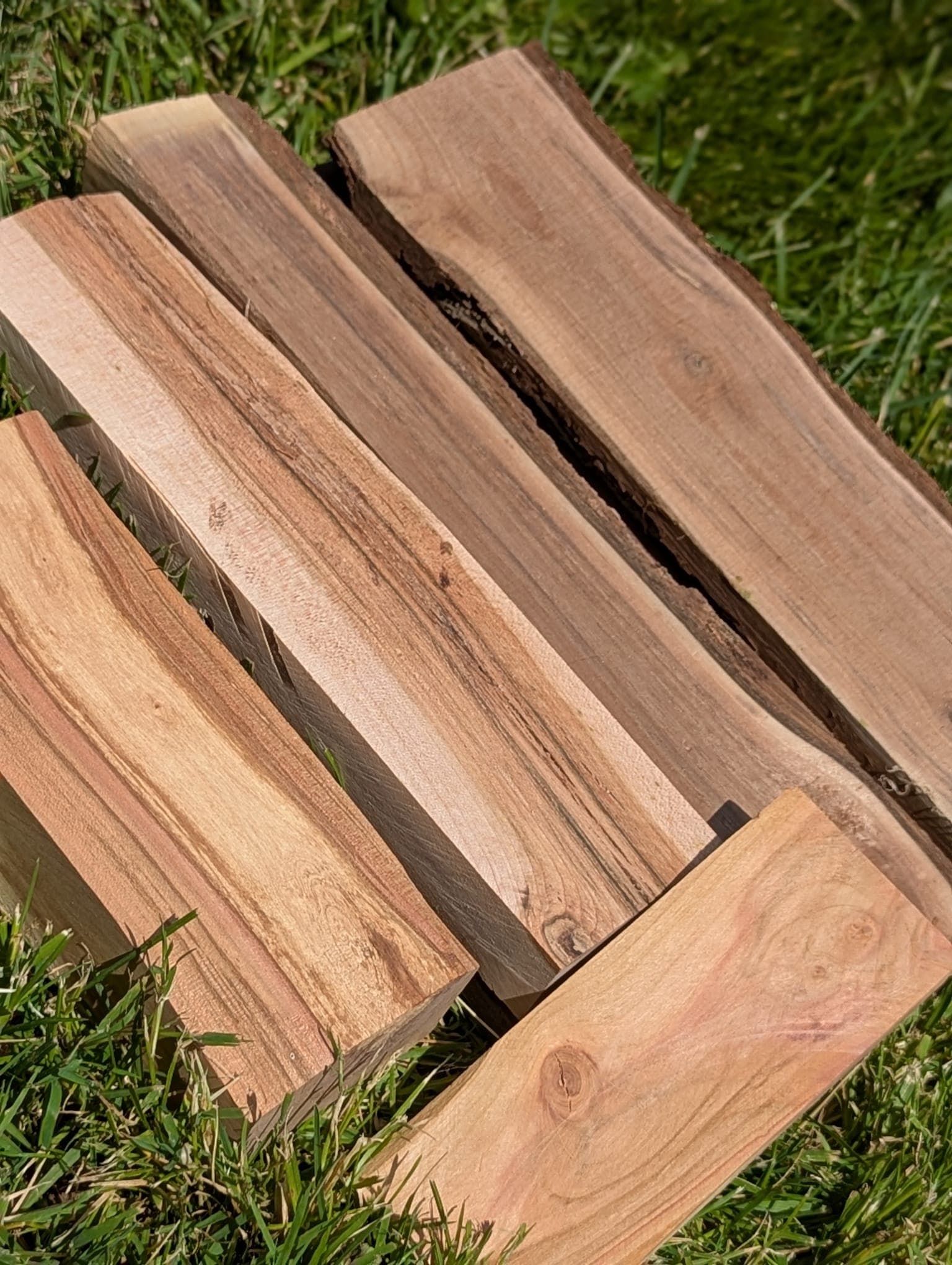 Raw pieces of wood lumber ready to be cut into eyeglass temple blanks